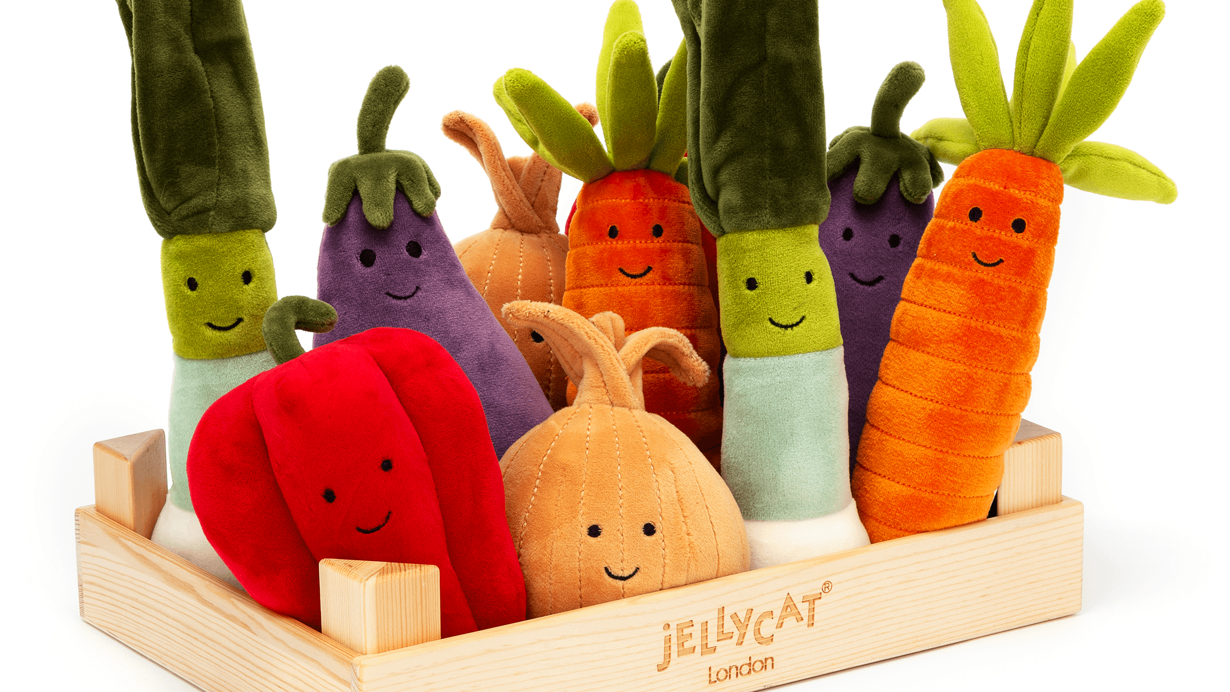 A collection of Jellycat's stuffed toys in the shape of vegetables