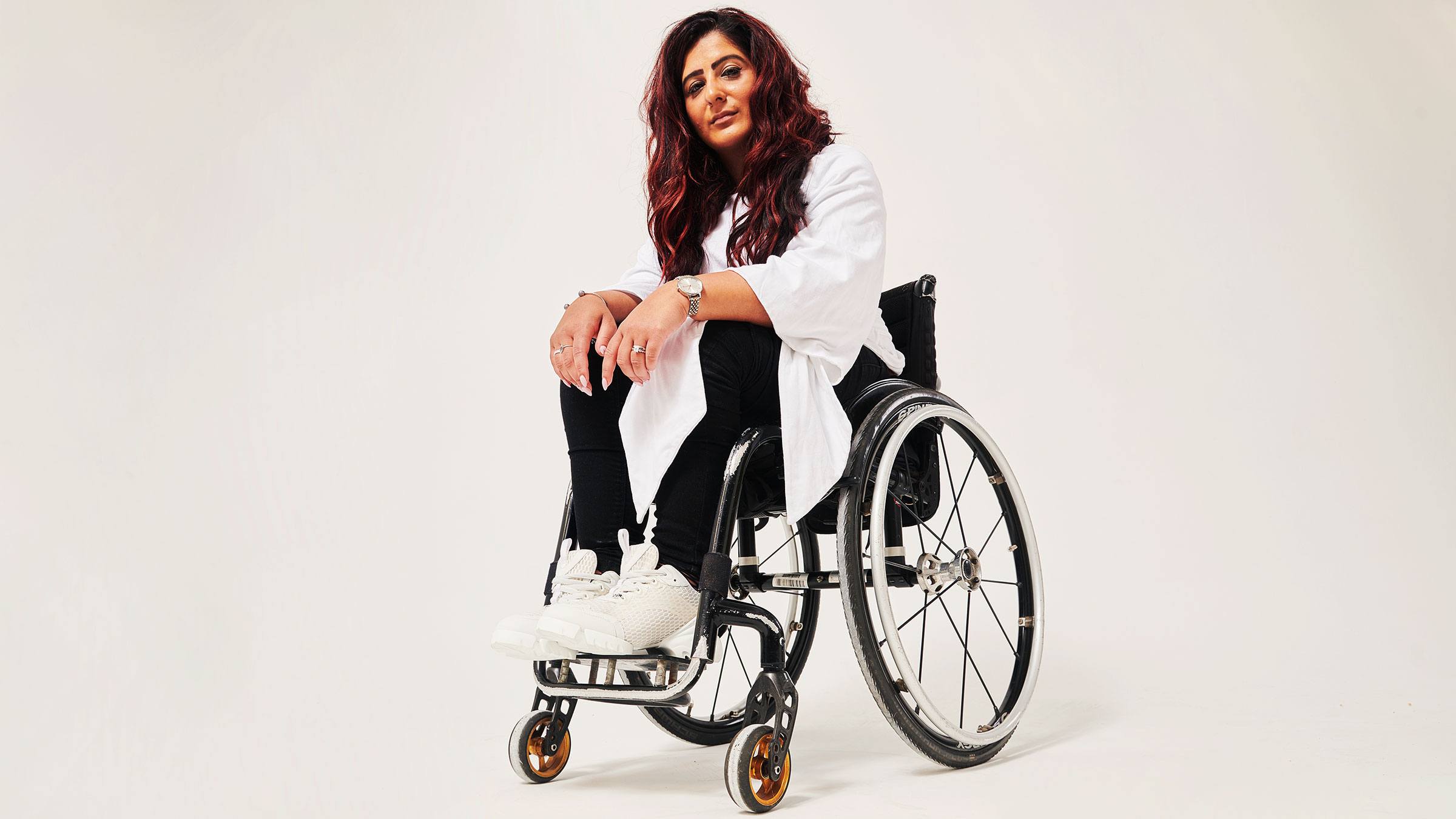 Women in a wheel chair modelling adaptive clothing