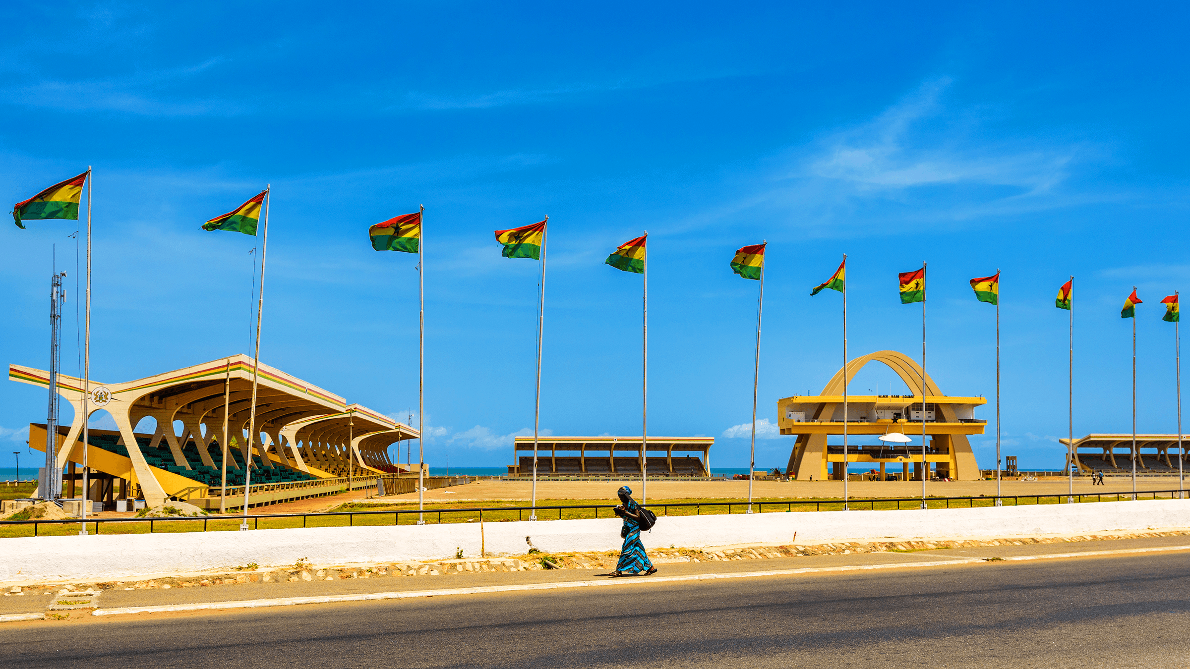 A road with Ghanain flags lining it