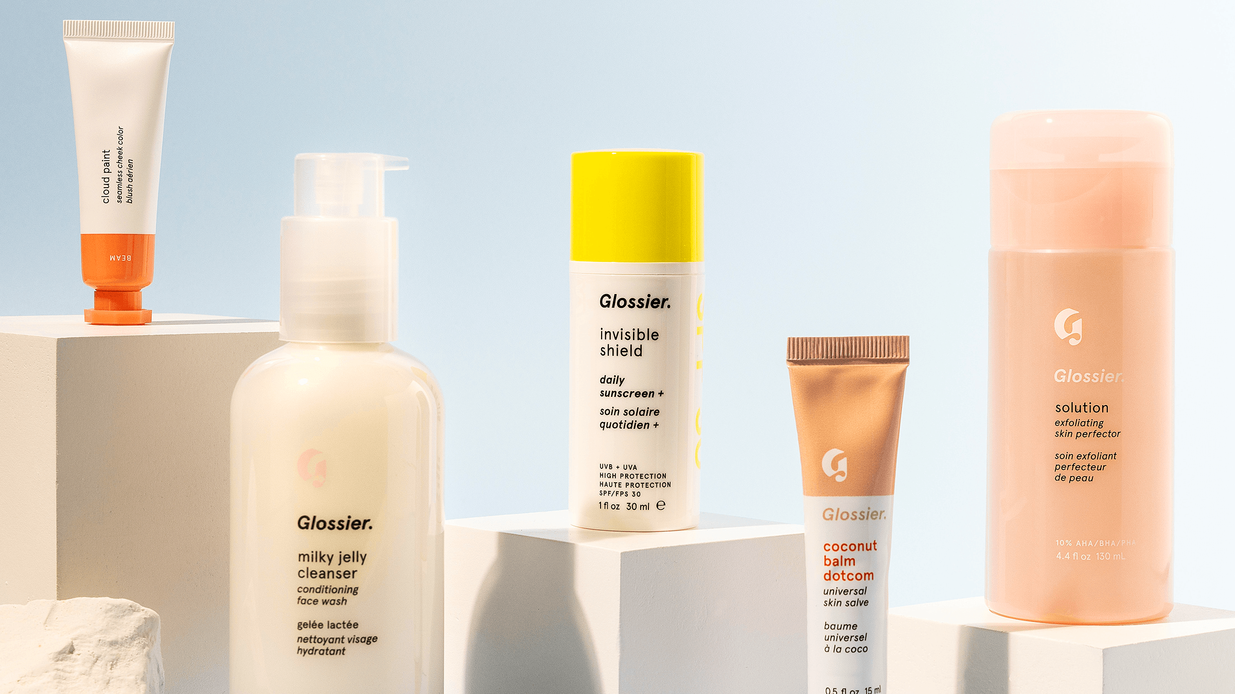 A range of Glossier beauty products