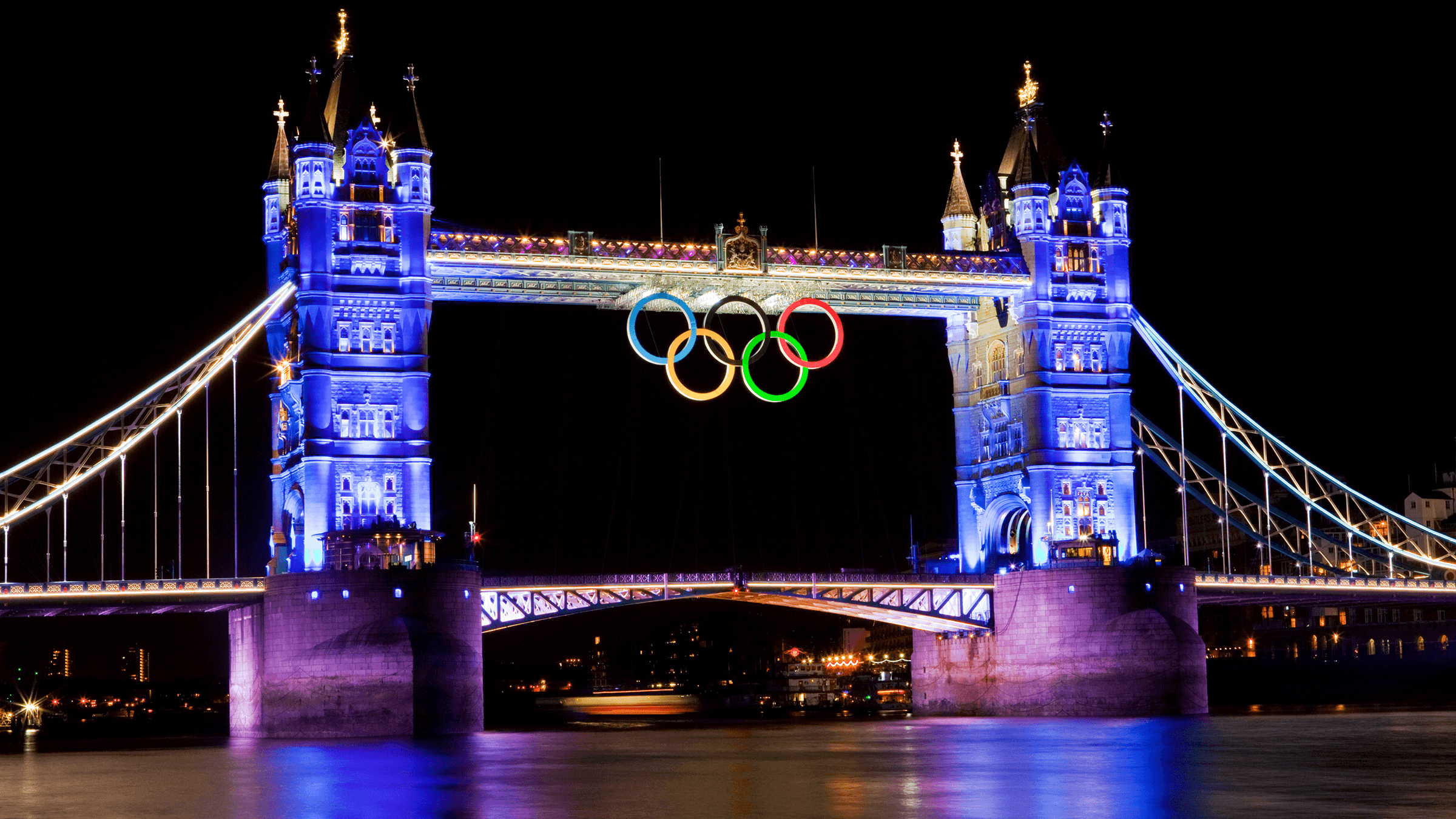 An image of Tower Bridge at night, adorned with the Olympic rings for the 2012 olympics