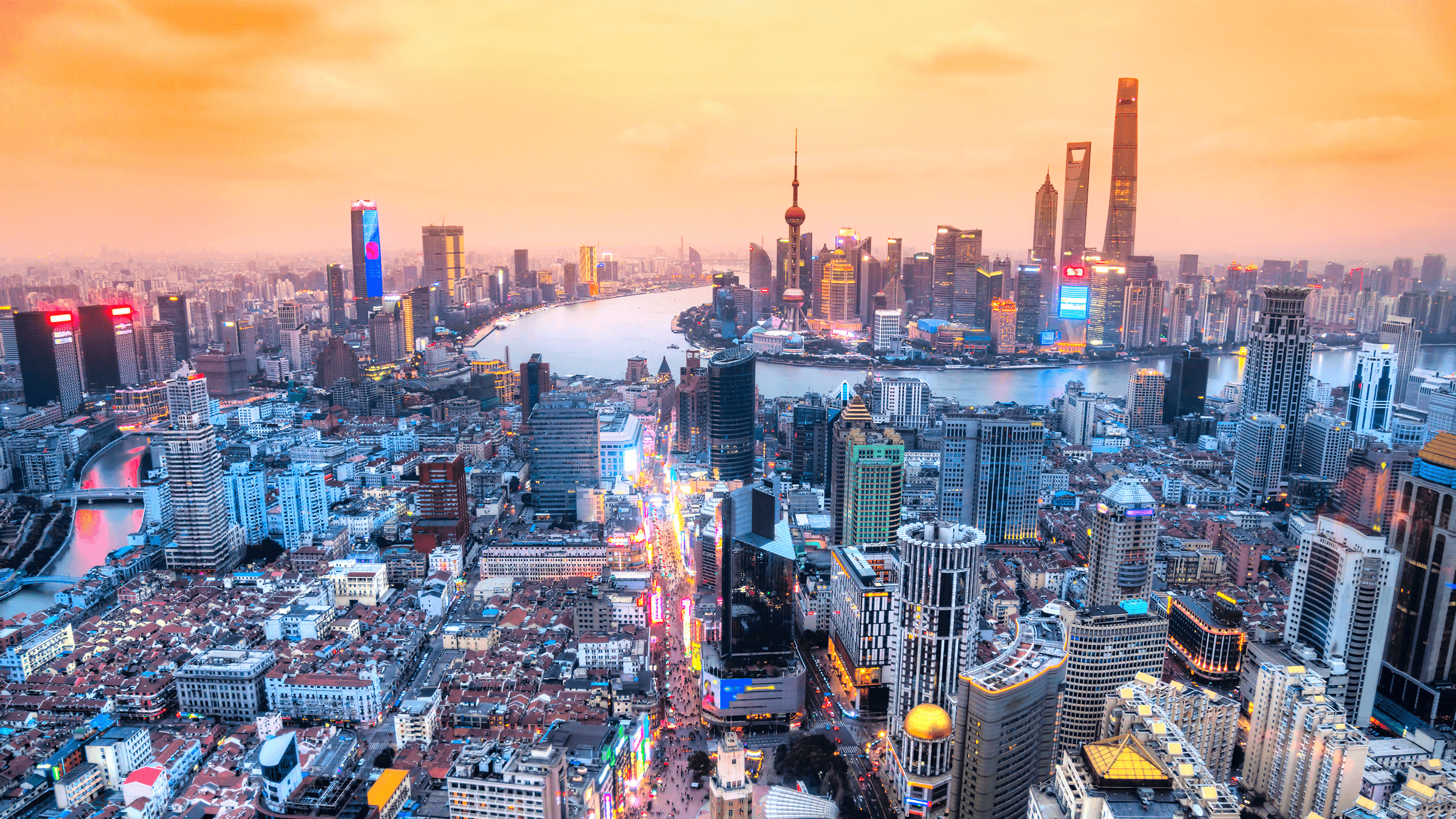 an aerial image of Shanghai city at sunset