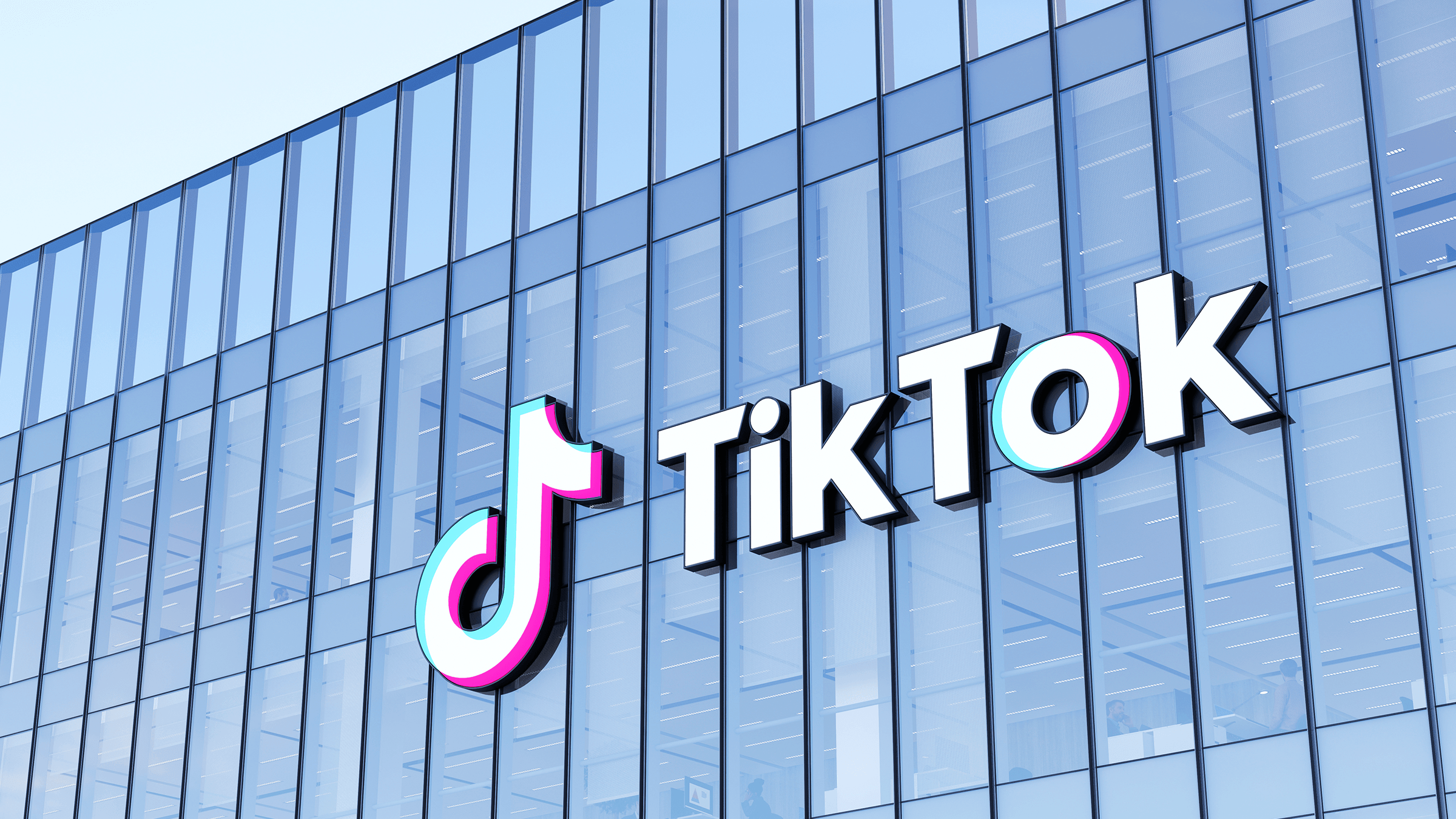 an image of the tiktok sign adorning a glass building
