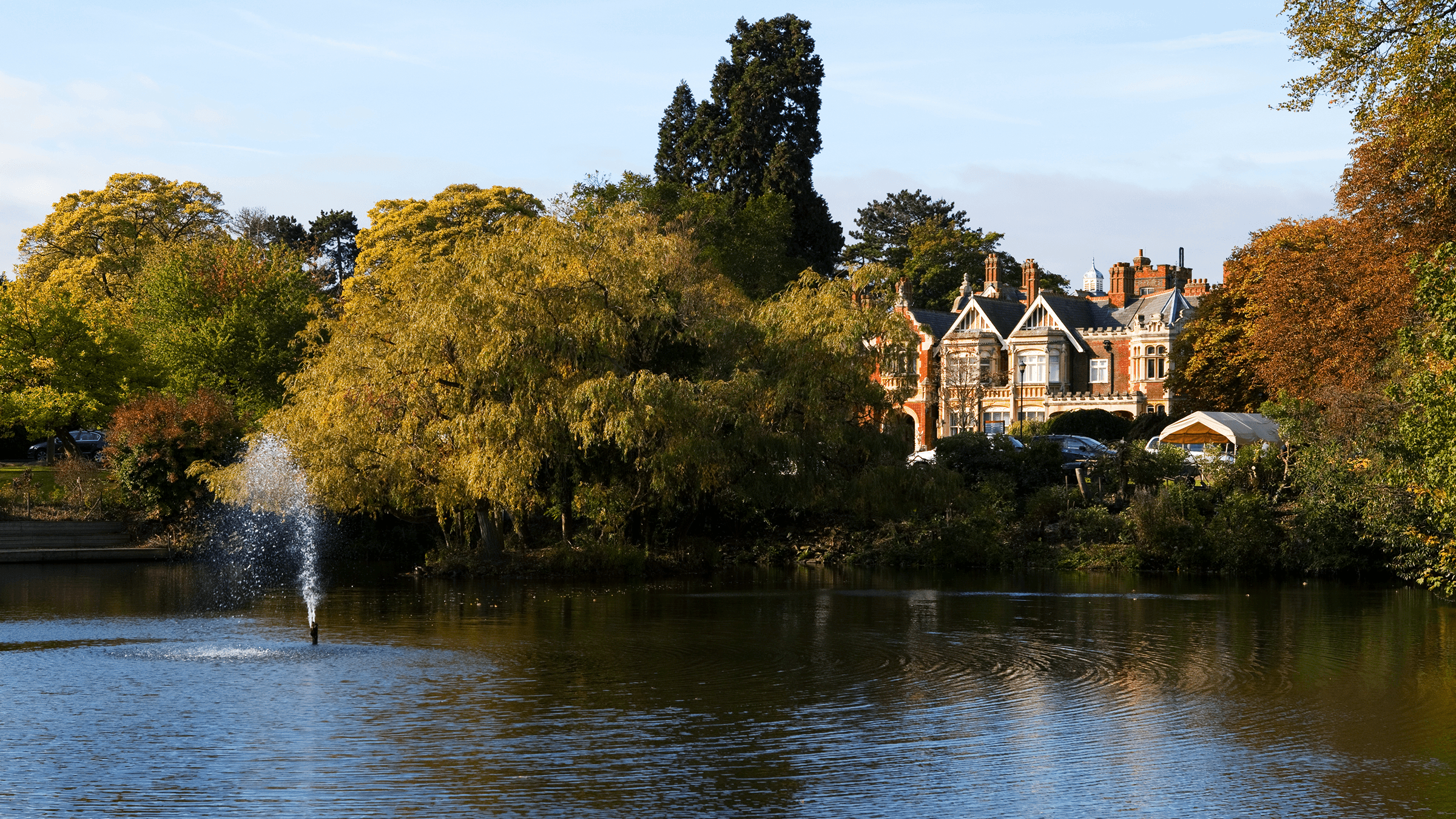 an image taken of Bletchley Park from across the great lake in the foreground.